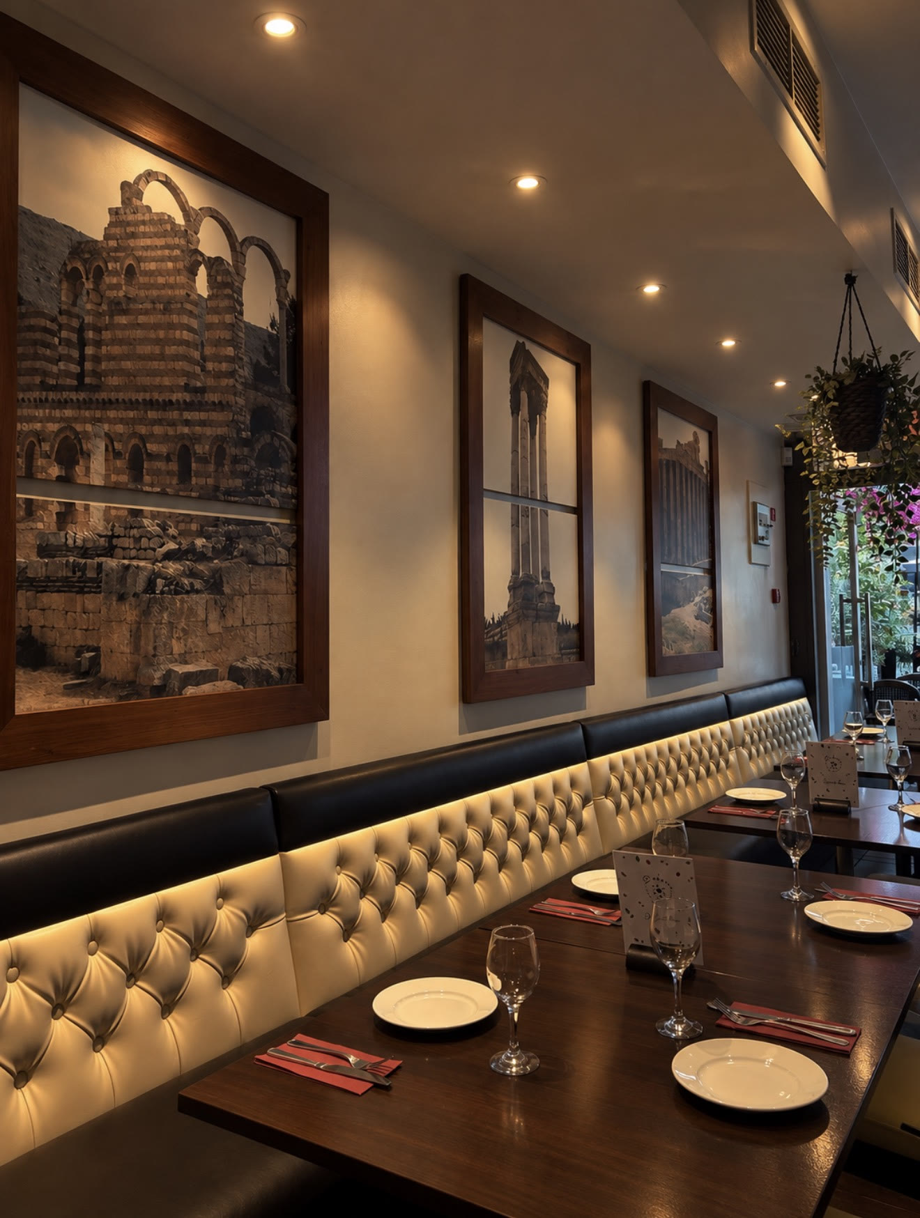 Dining room with framed photographs of Lebanon's ancient ruins