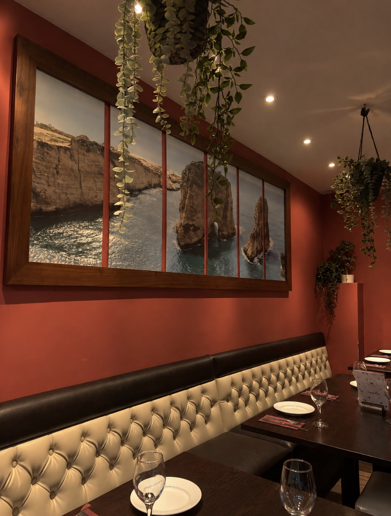 Dining room with a painting of Beirut's Pigeon Rocks